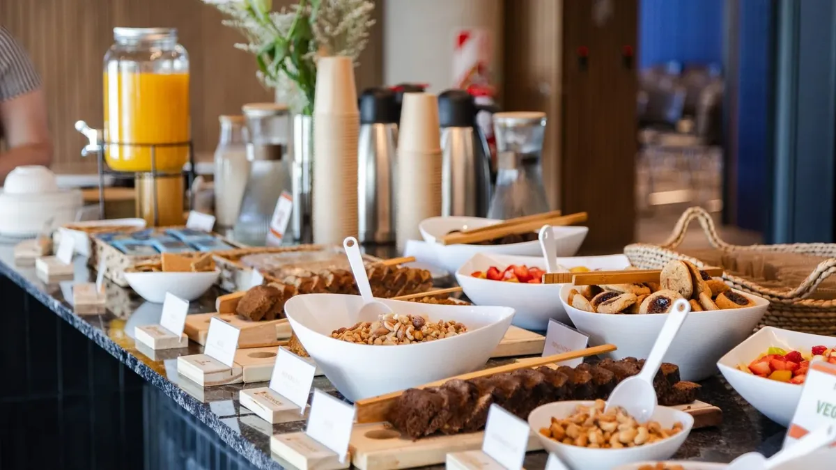 Cascanueces healthy catering at a corporate event: bowls of nuts, cakes, cookies and fresh fruit